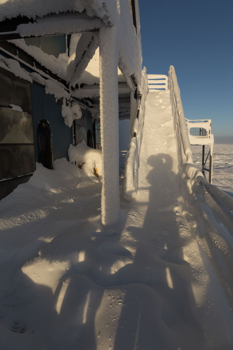 Snow-covered stairs of the IceCube Lab
