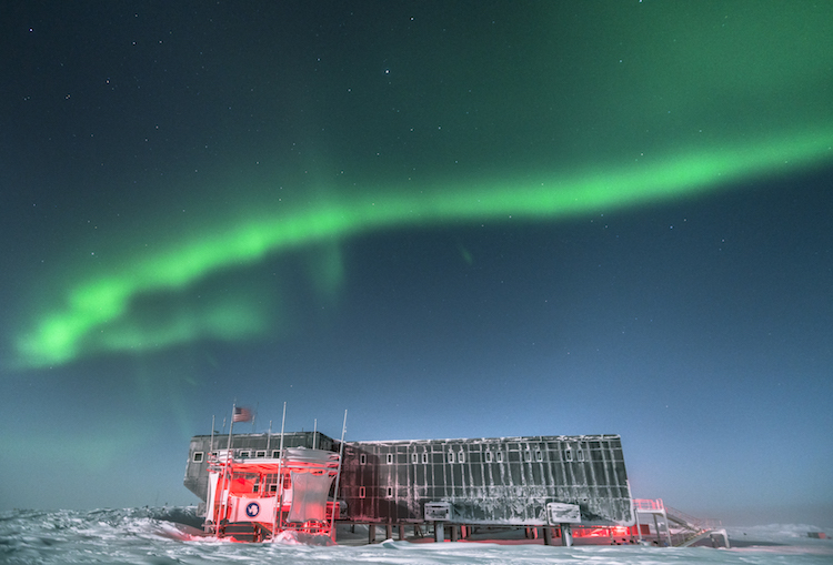South Pole station under aurora