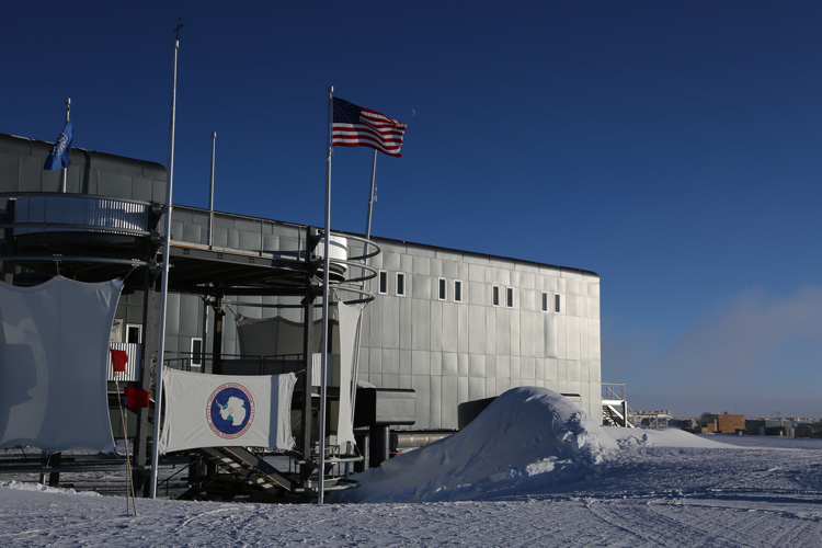 South Pole station, moon faintly visible in daylight