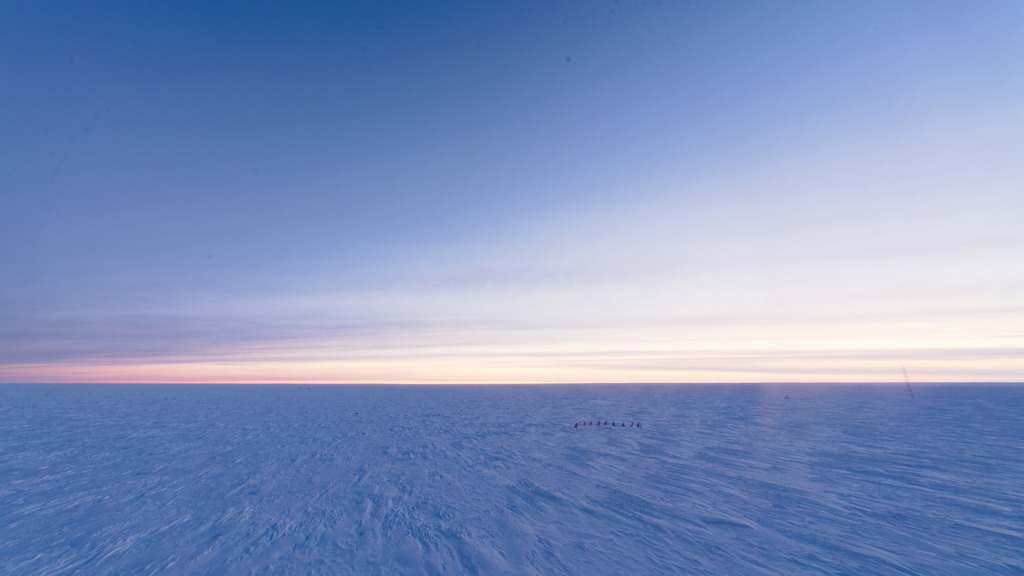 Sunrise brightening the horizon at the South Pole