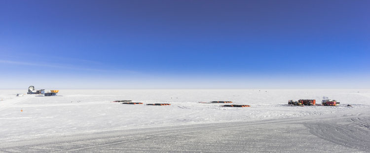 Distant view of South Pole traverse bladders spread out on snow