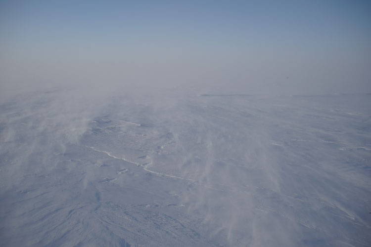 Windy South Pole landscape, hard to distinguish ground from sky, or the horizon 