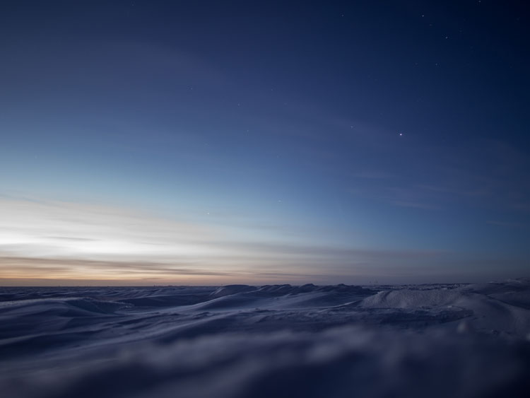 sunset over snowdrifts