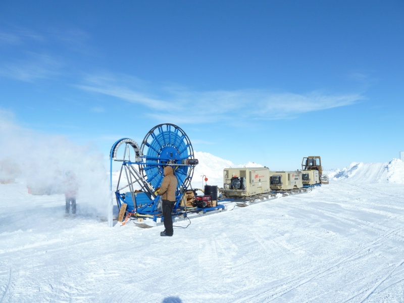 <span class="jb-title">The RAM drill is new at the South Pole and uses compressed air to extract hole-shavings. This produces a dry hole 4 inches in diameter. A 60-meter hole only took 15 minutes to drill.</span><br/>