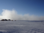 Cloud of snow dust as plane departs South Pole